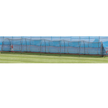 A long black netted backyard batting cage on a green lawn, seen from the side.